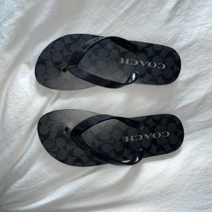 NWOT Coach black flip flops. Women’s size 5-6